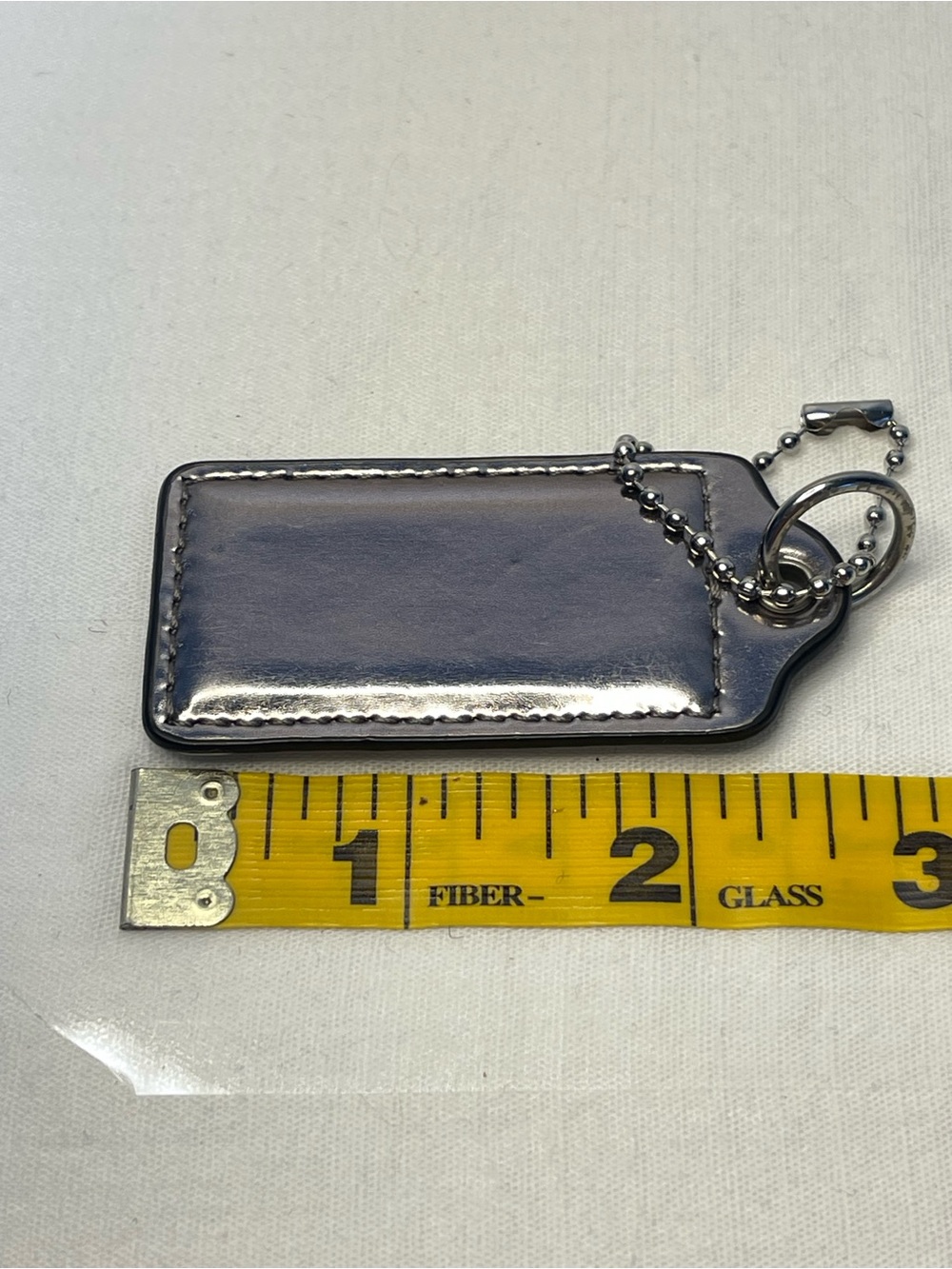 Coach Silver Metallic Leather Hang Tag with Ball Chain - Picture 2 of 3